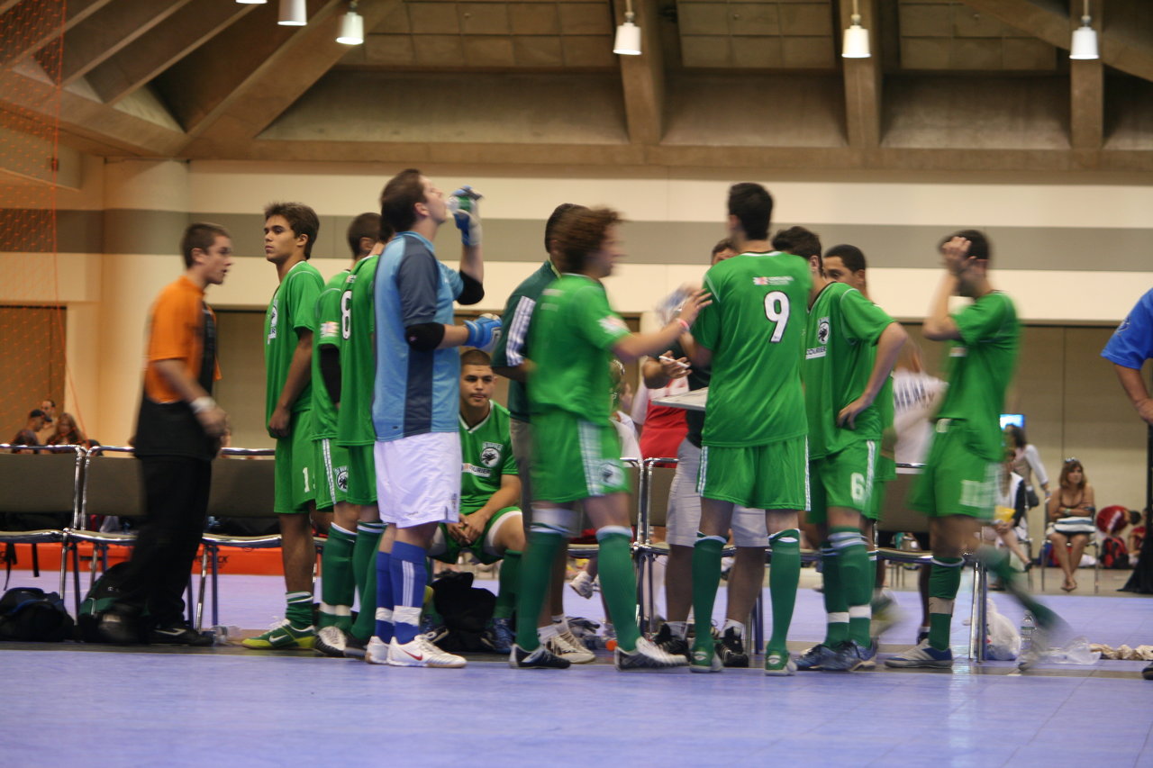 Di Bufala U19 players gather during a futsal timeout.